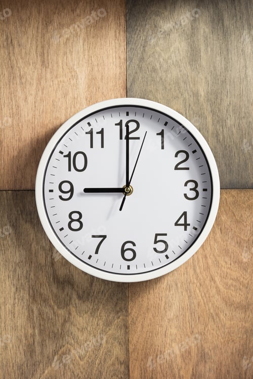 Preview: wall clock at wooden background