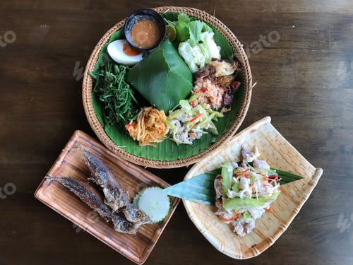 Delicious Thai Cuisine Served on Wooden Table
