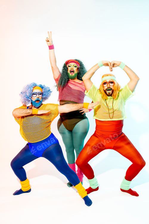 Preview: Colorful Drag Queens in Retro Outfits Strike Superhero Poses Against a White Background