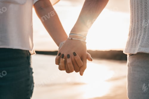 Preview: Portrait and close up of two hands holding each other together enjoying