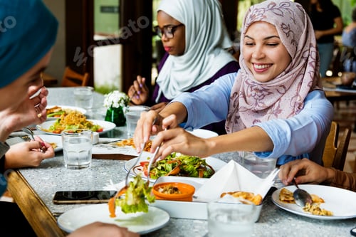 Preview: Islamic women friends dining together with happiness