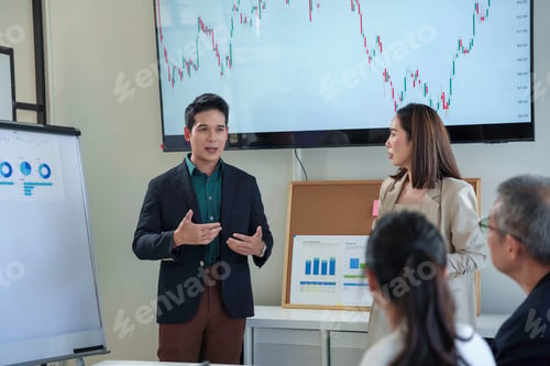 Preview: Business executives and managers meeting in conference room presenting project explaining charts