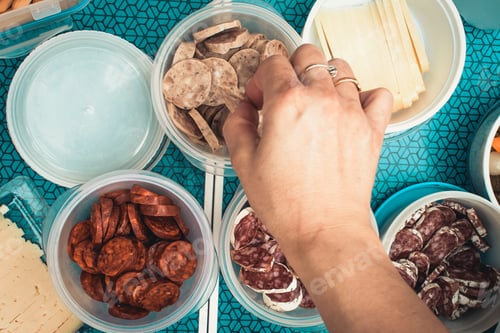Preview: Sausage cut into pieces and potatoes for a picnic in the field.