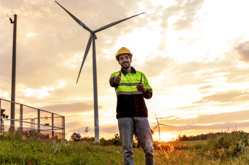 Preview: Professional Man Maintenance engineers working in wind turbine farm at sunset