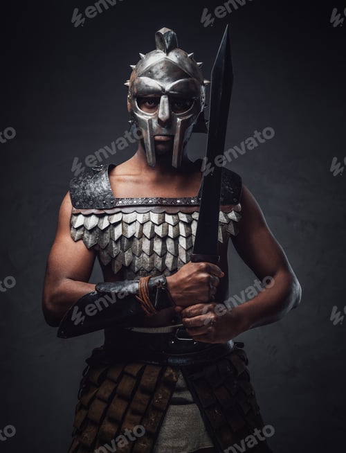 Preview: Proud antique gladiator with sword against dark background