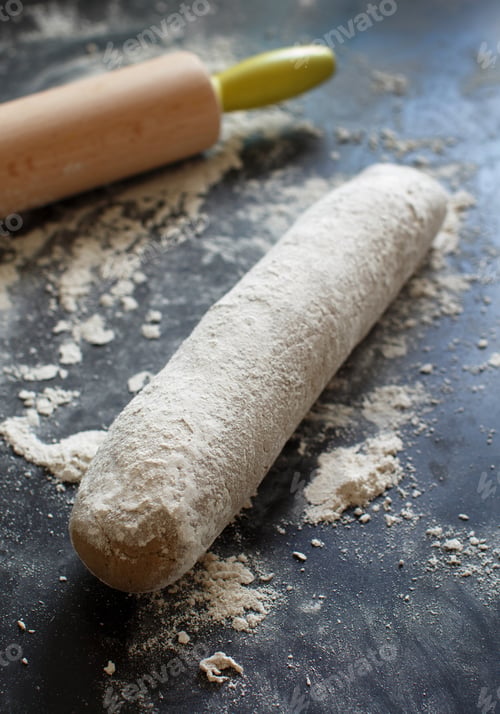Preview: Raw dough with a rolling pin