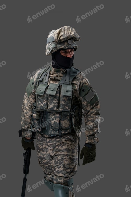 Preview: Ukrainian soldier dressed in camouflage clothes with rifle