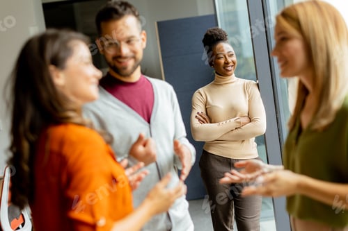 Preview: Cute Africam American woman with her young multiethnic startup team working in the modern office