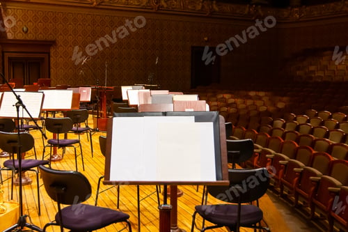 Preview: Music books and sheets with musical notation on the stands ready to the concert. Equipment of the
