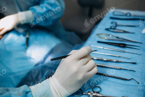 Preview: Medical Professional Preparing Surgical Tools for Operation