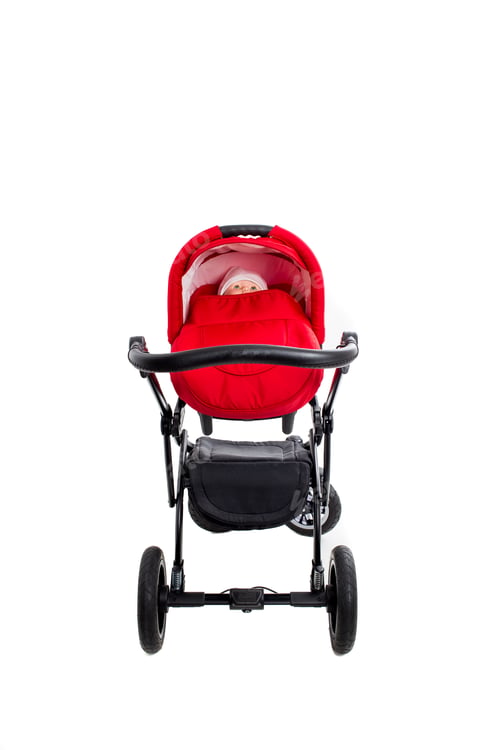 Preview: Infant in a Stroller on a White Background