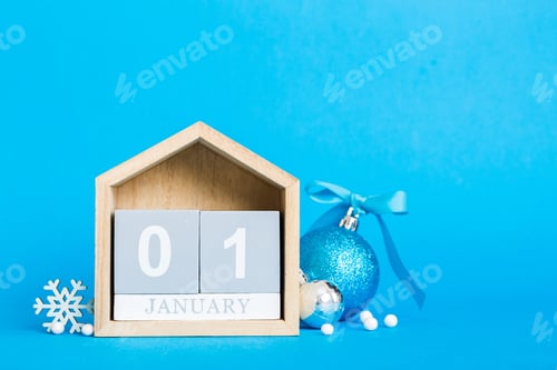 Preview: 1 january. Christmas composition on colored background with a wooden calendar