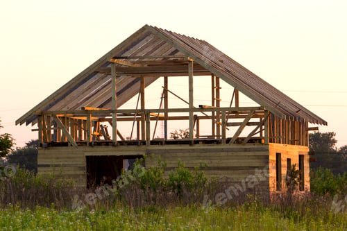 Preview: New cottage of natural ecological lumber materials under construction in green field. Wooden walls