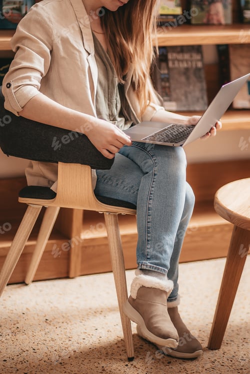 Preview: young girl working on laptop remotely