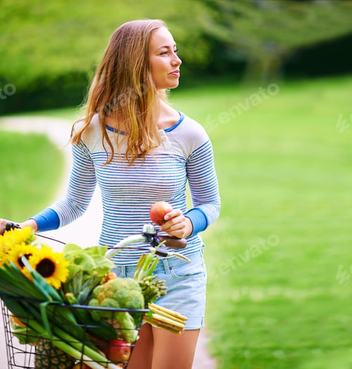 Preview: Escape to the countryside. Shot of a young woman cycling in the park.