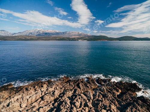Preview: Rocky coastline on the Lustica peninsula overlooking Mount Lovcen in Montenegro. Aerial top view.