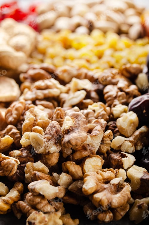 Preview: Closeup view at walnut nuts on kitchen table. Vegetarian food concept