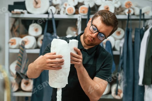 Preview: Bandages the raw material. Technician working in modern laboratory