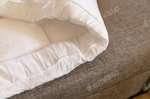 Preview: A mattress topper is placed on a sofa, providing extra comfort for sleeping