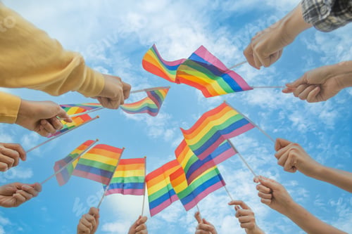 Preview: Diversity people hands raising colorful lgbtq rainbow flags together