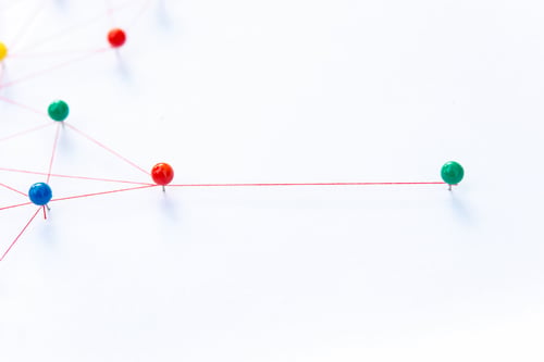 Preview: connection between the two networks. Network simulation on paper linked together by yarn