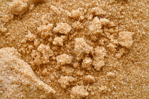 Preview: Clumped brown sugar texture background.