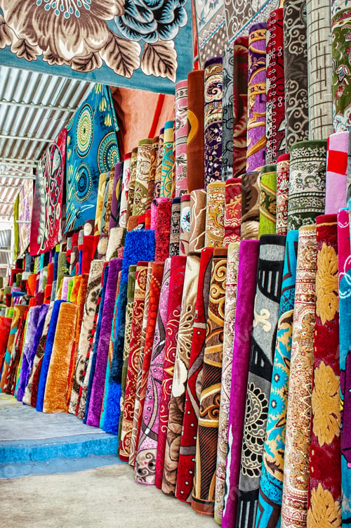 Preview: Heap of rolled up rugs in rug store