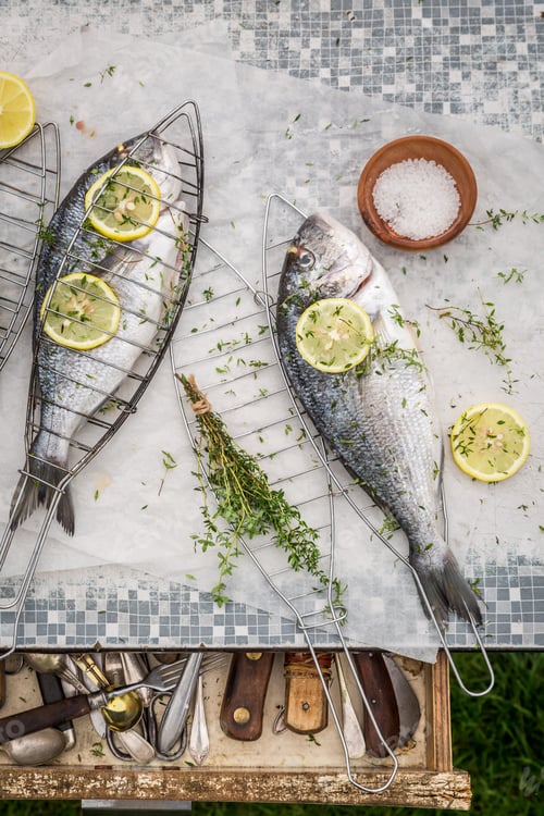 Preview: Fresh whole sea bream in the summer garden
