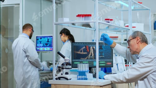 Preview: Elderly man technologist doing laboratory test