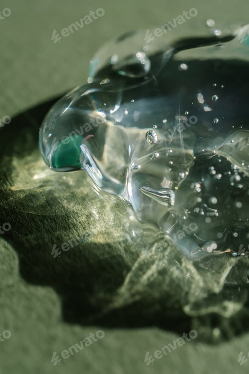 Preview: Transparent cosmetic gel on a green background.