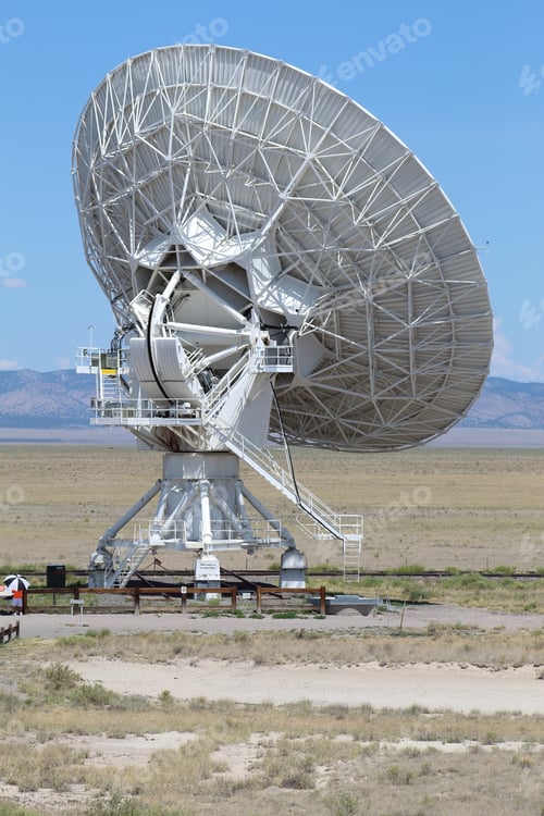 Preview: Vertical shot of the large radio telescope in the field near Socorro on a sunny day, New Mexico
