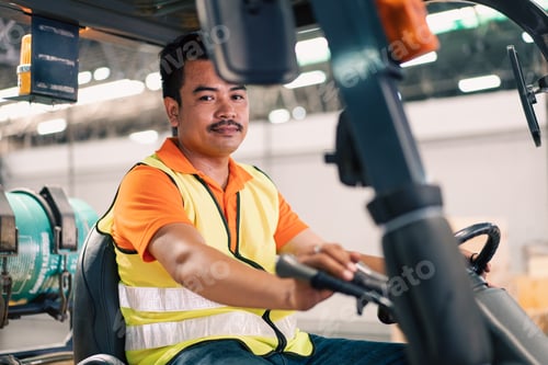 Preview: Asian male driver driving forklift to shipping delivery in the warehouse distribution