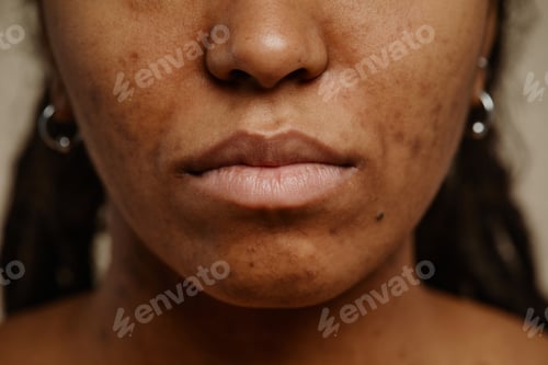 Preview: Macro shot of ethnic young woman with real skin texture and nude lips