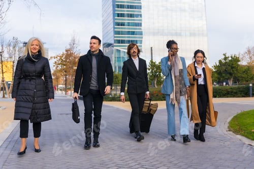 Preview: Multi-ethnic business people, business park, coworkers, walking to work