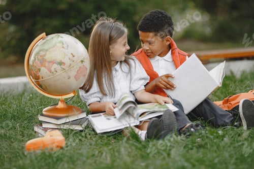 Preview: Little african boy study with caucasian girl