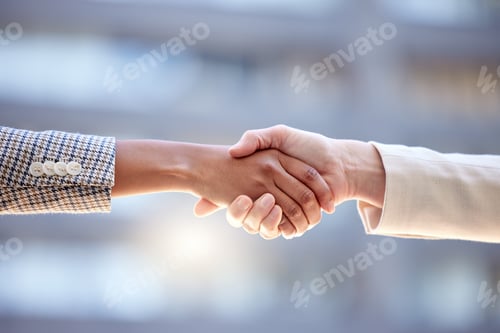 Preview: Shot of two unrecognizable businesspeople shaking hands against a city background