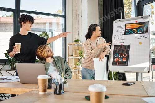 Preview: Young businessmen in their 20s brainstorming and analyzing graphs for business strategy