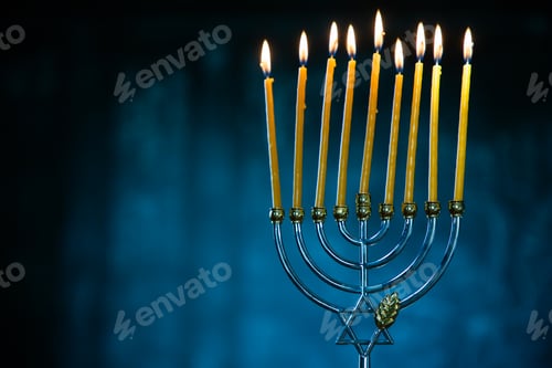 Preview: candles burning in menorah for Hannukah