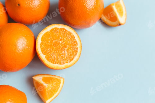 Preview: Fresh oranges on the blue background
