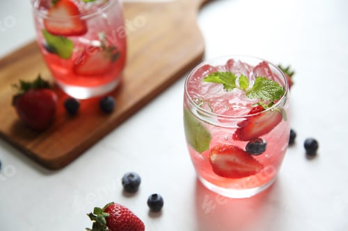 Preview: Strawberry Juice Cocktail With Ice And Mint On White Tone Amd Wooden