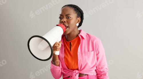 Preview: Megaphone, angry and black woman on gray background for protest, revolution and rights for equality