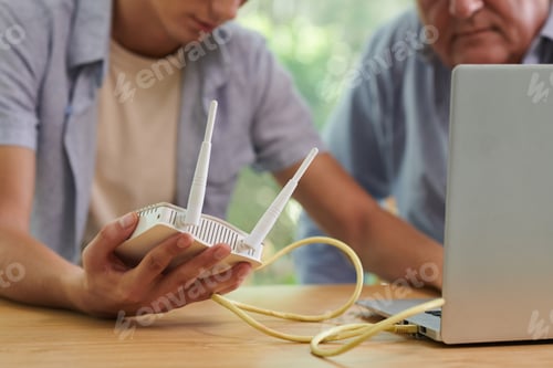 Preview: Man Installing Wi-Fi Router
