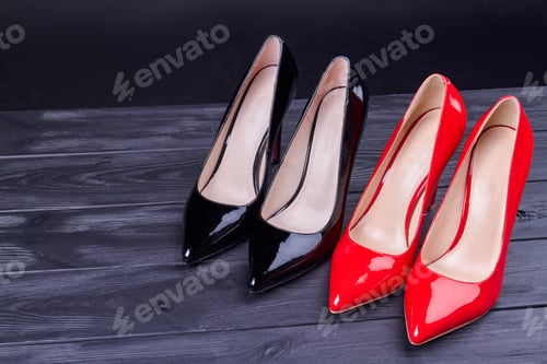 Preview: Pair of red and black high heel shoes.
