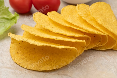 Preview: Empty mexican taco shells close up on a stone background