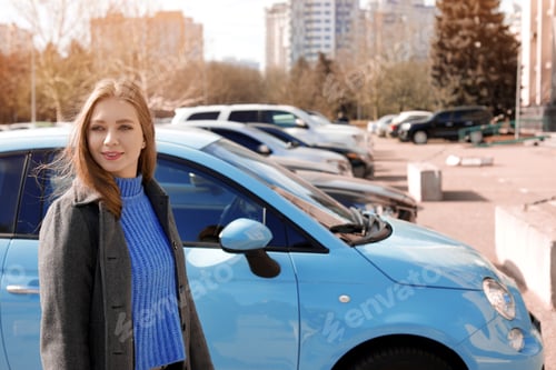 Preview: Portrait of beautiful young woman near parked cars on sunny day