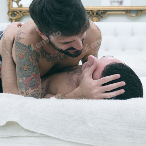 Preview: Happy gay couple on bed in the morning shirtless
