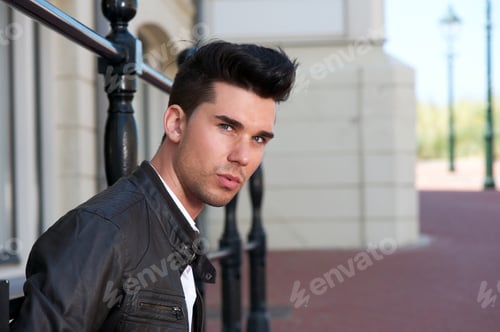 Preview: Portrait of a handsome young man in black leather jacket