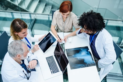 Medical Professionals Collaborating on Patient Diagnosis in Office