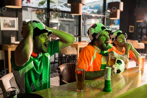 Preview: Football fans watching game and screaming in bar