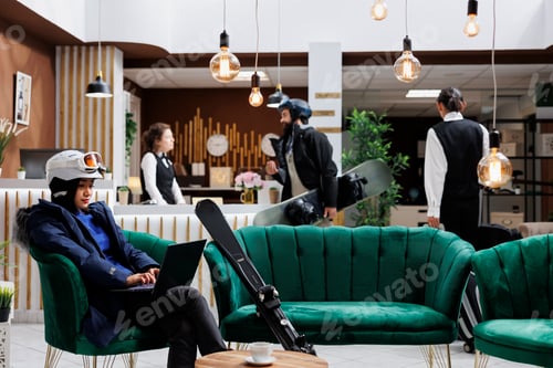 Preview: Ski hotel lobby relaxation with laptop